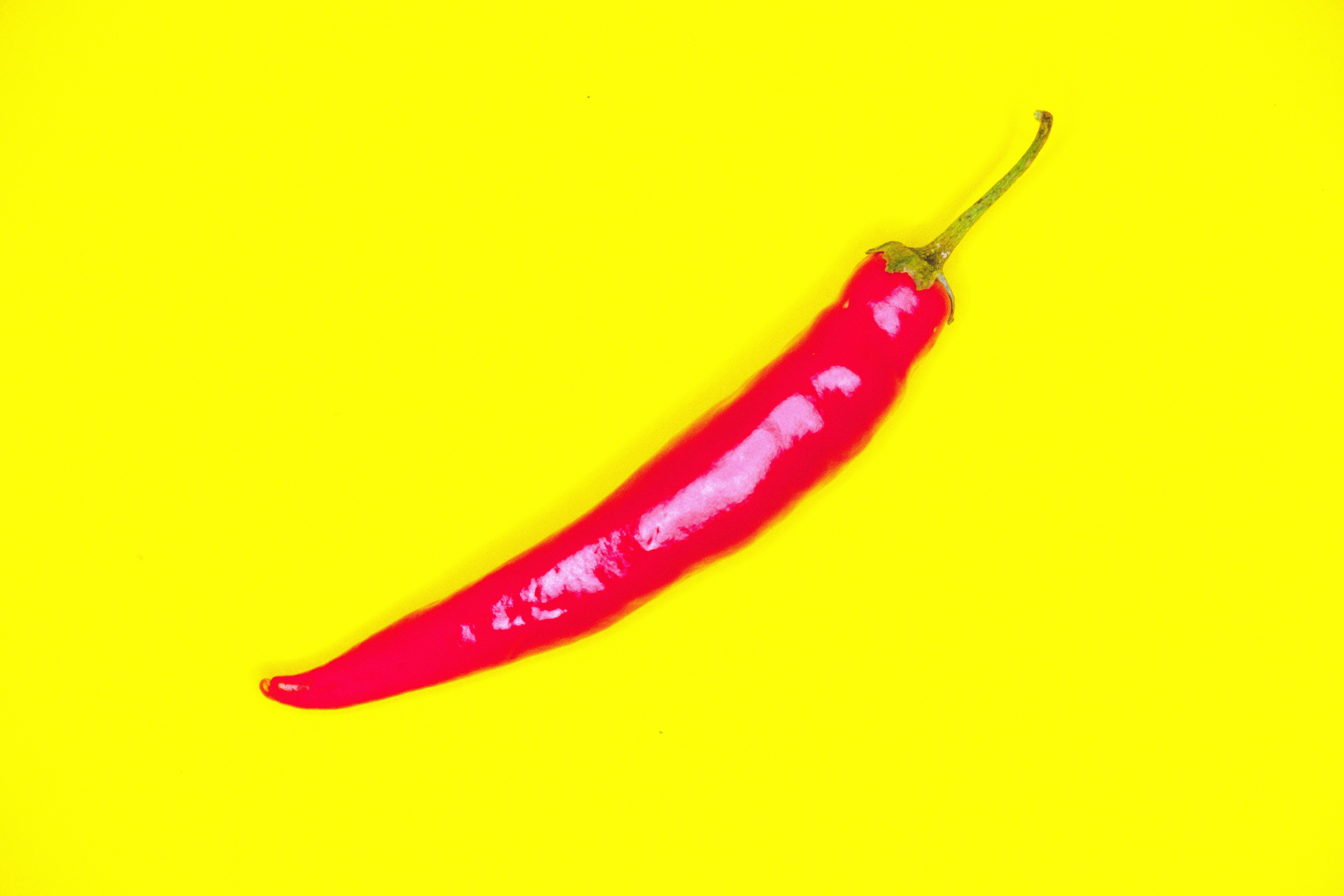 red chili on yellow background